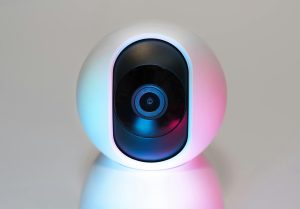 Futuristic IP security camera in soft lighting, perfect for modern smart home setups.